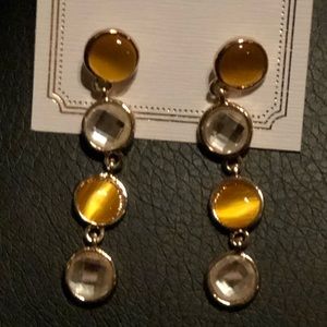 Green stone with gold metal trim dangle earrings